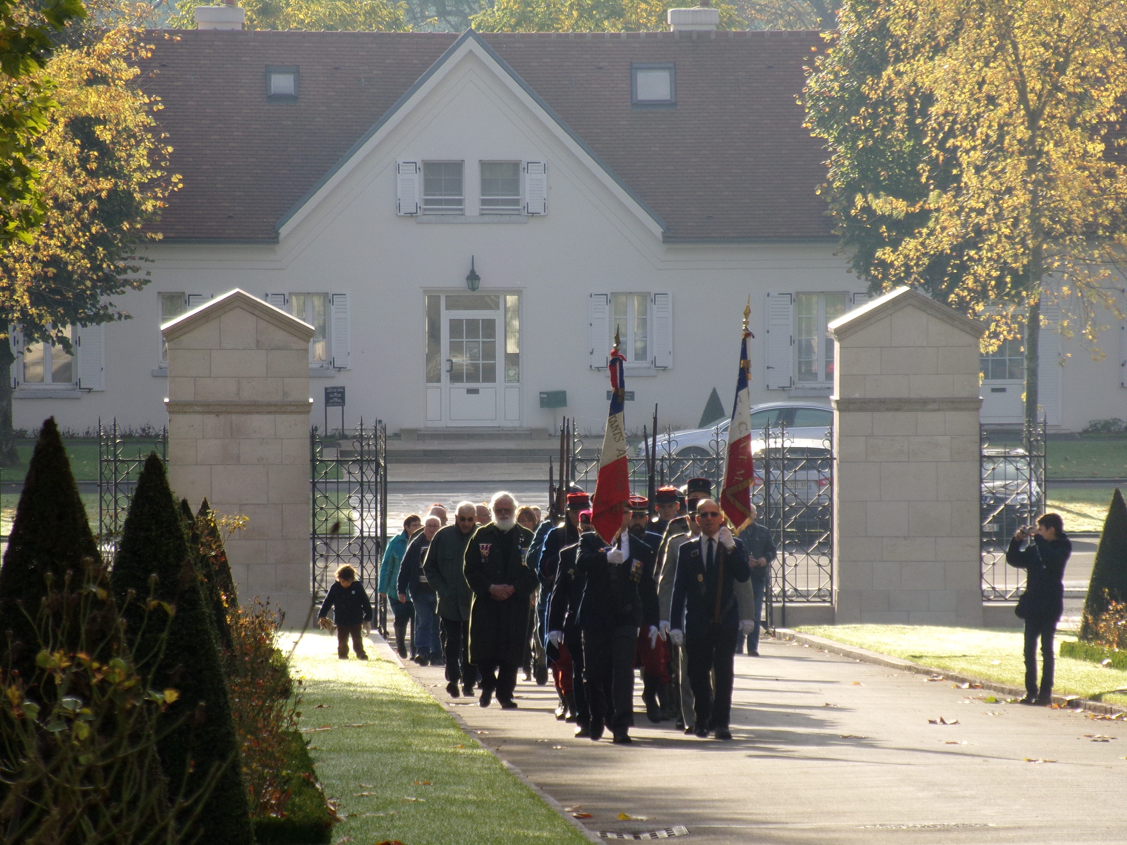 Participants march into the cemetery for the ceremony.