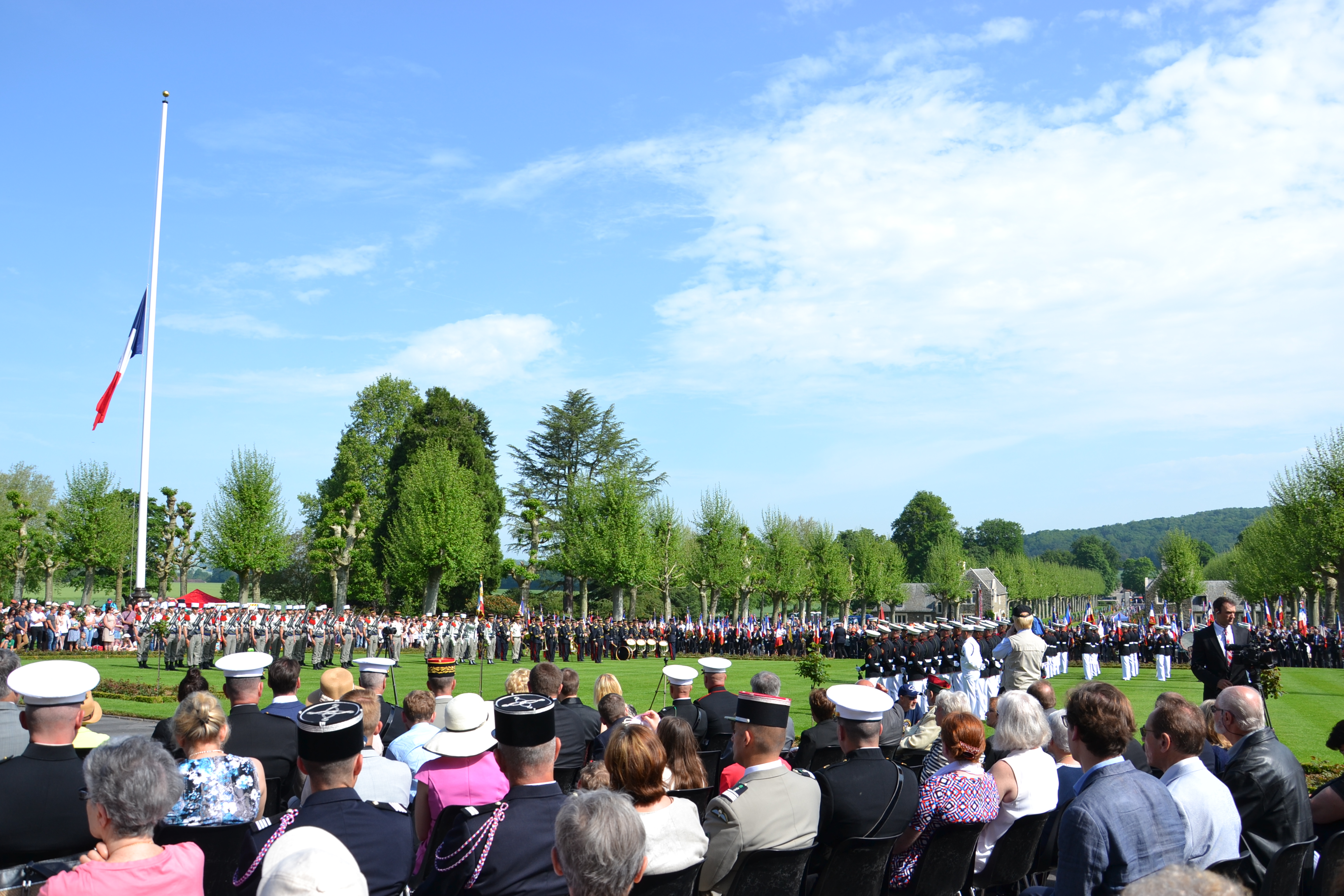 Attendees sit as they watch members of the military participate in the ceremony.