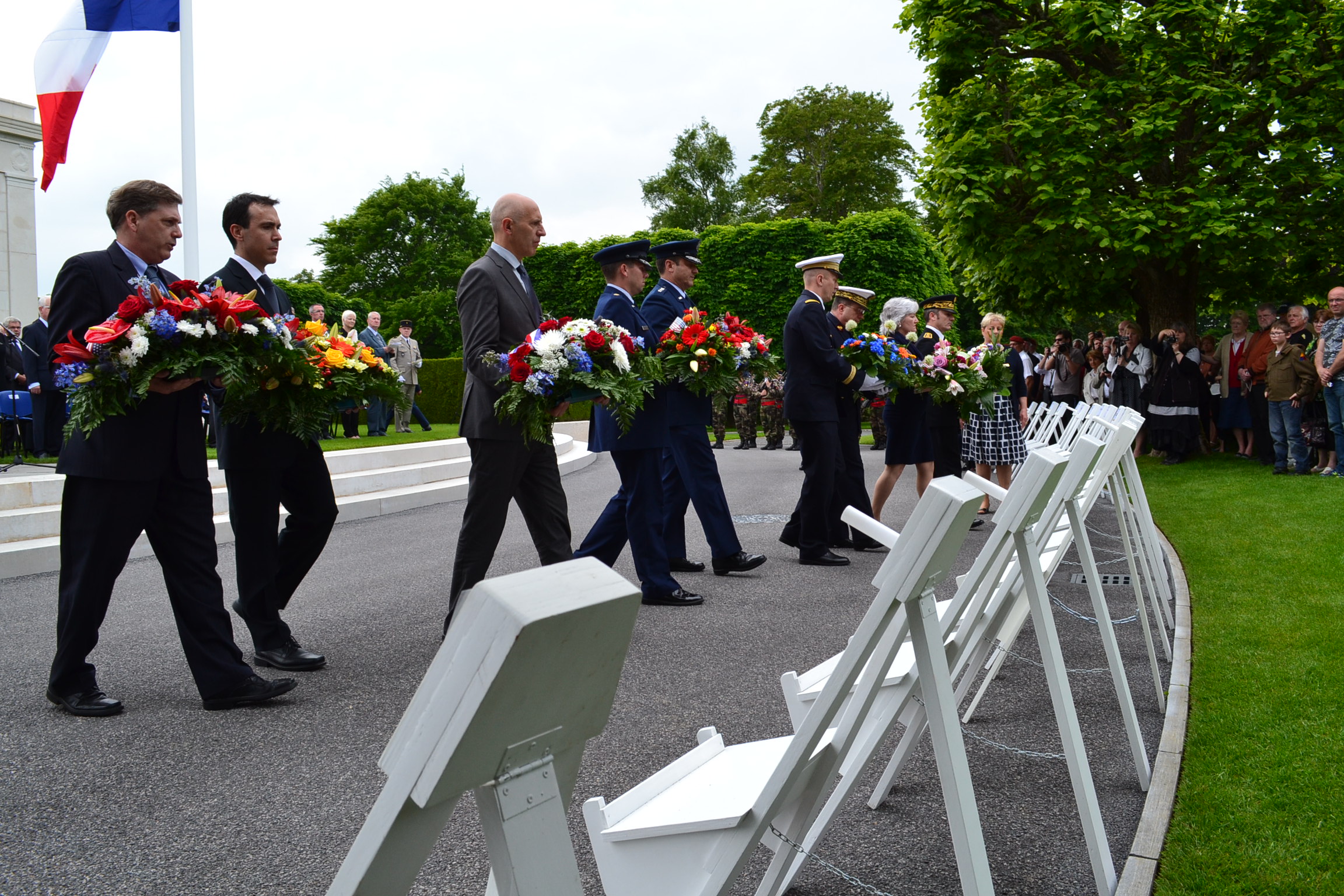 Members of the official party prepare to lay wreaths during the ceremony. 