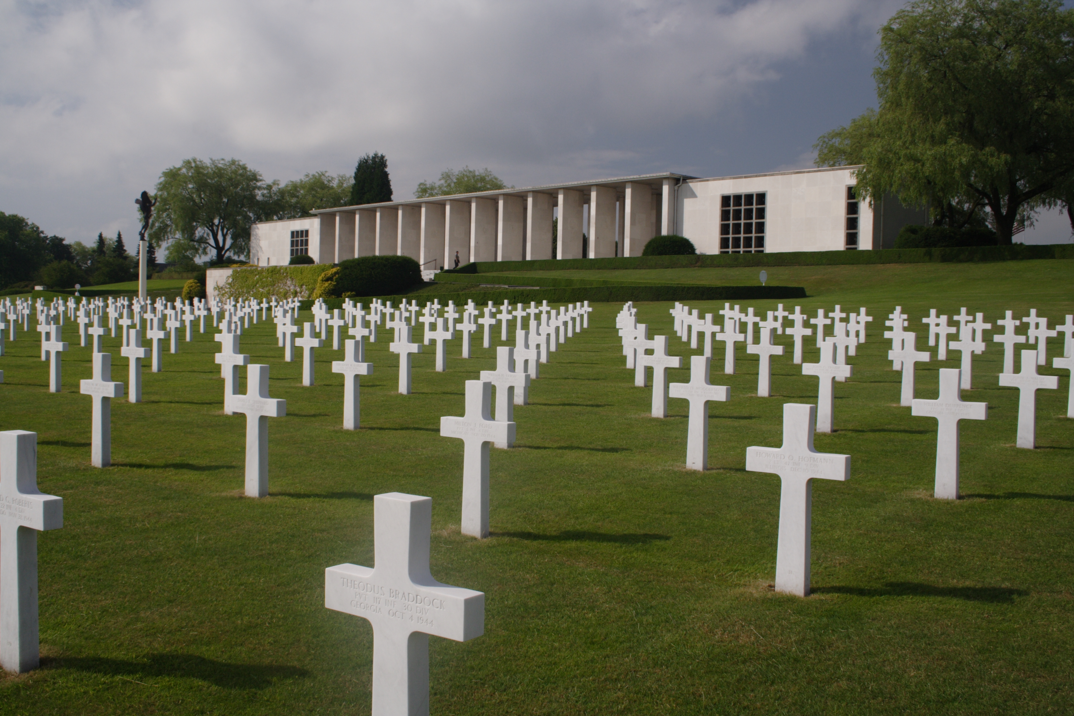 Headstones in front of the memorial building at Henri-Chapelle American Cemetery.