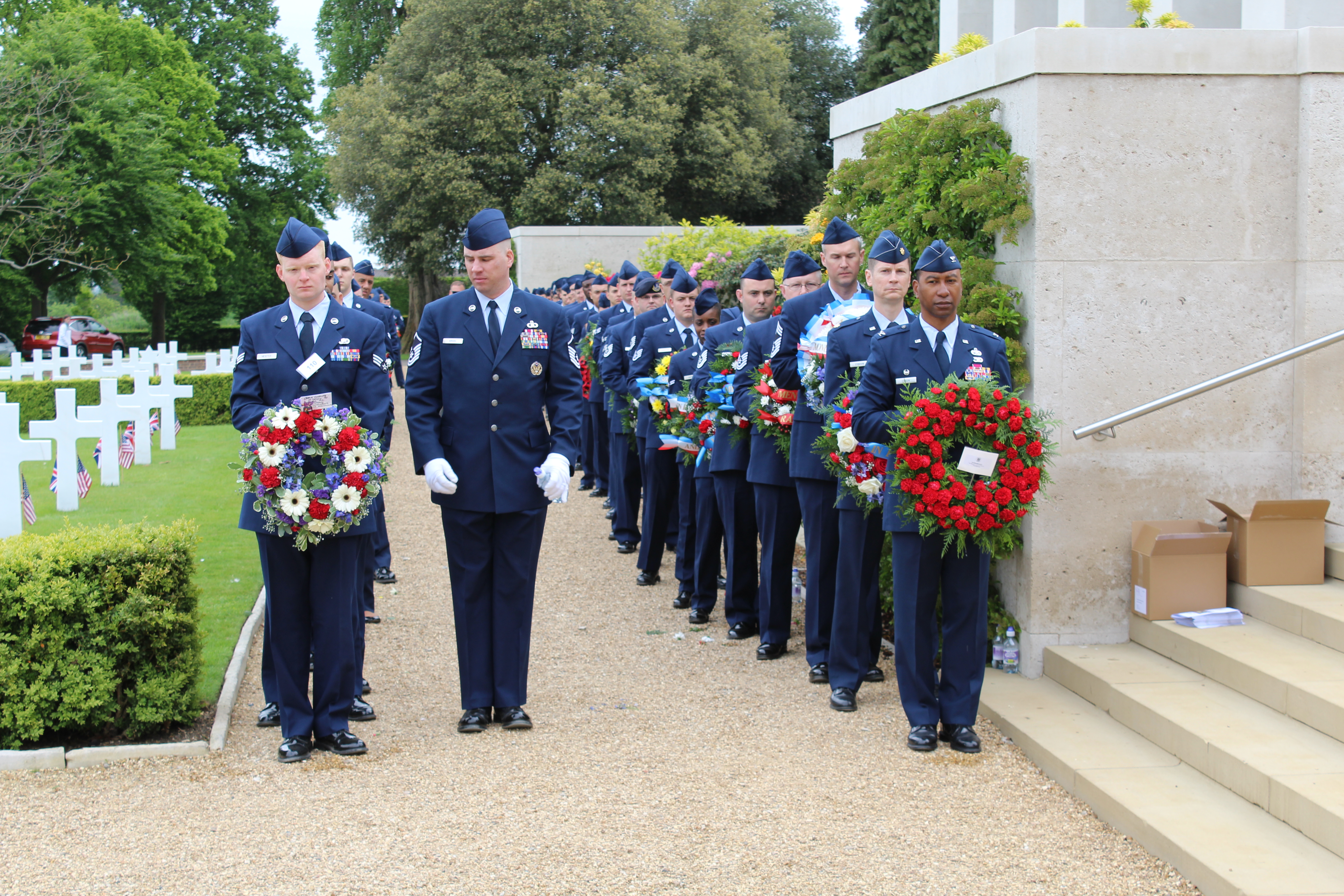 Members of the Air Force carry floral wreaths during the ceremony. 