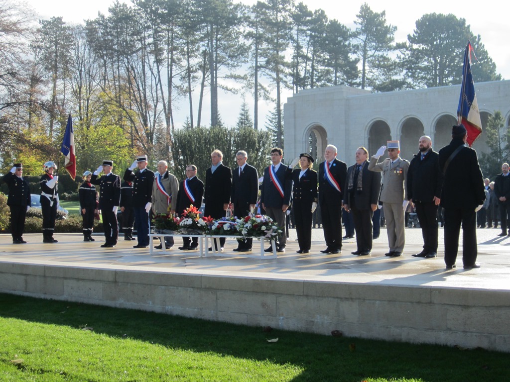 Members of the official party salute after the wreaths have been laid.