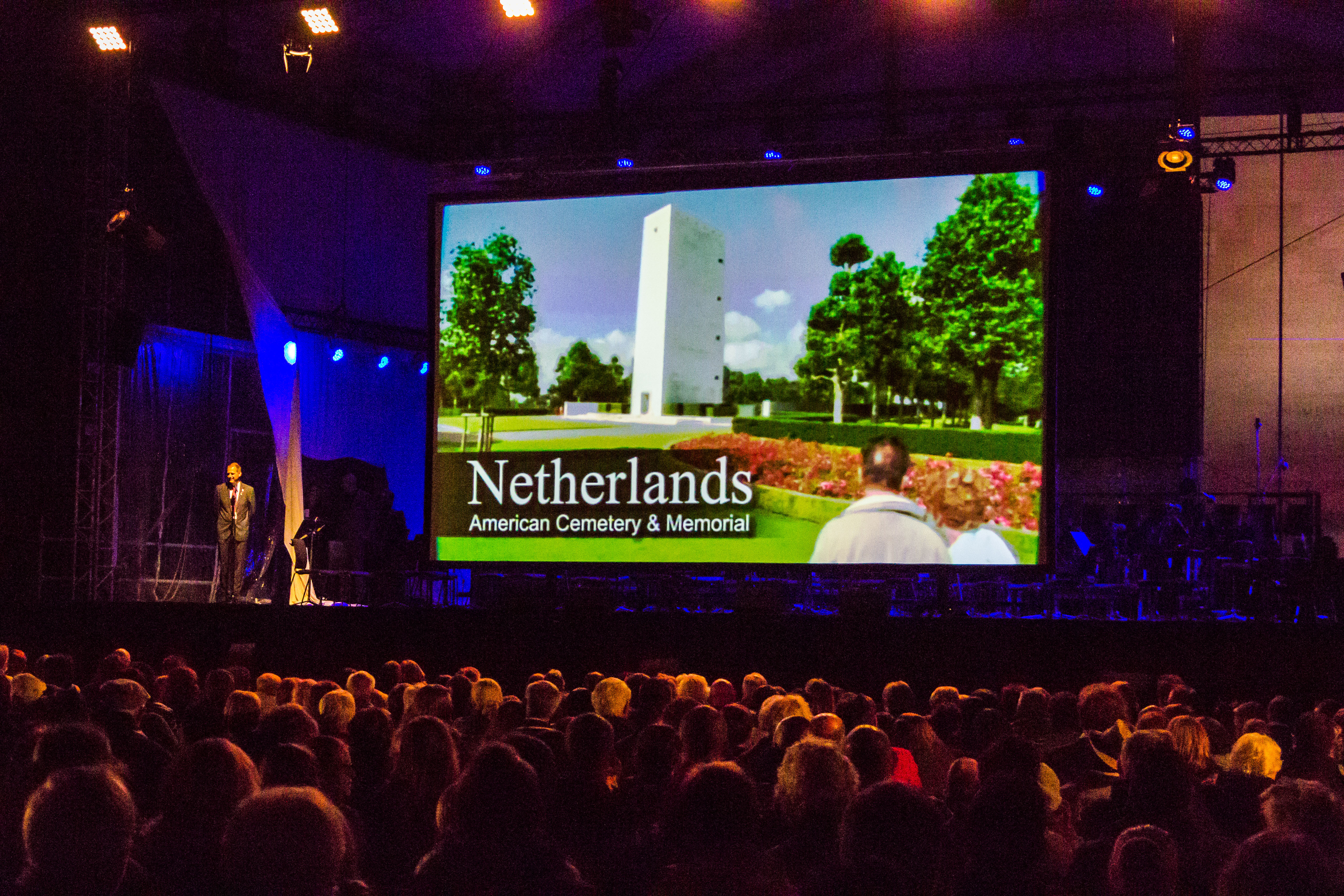 Netherlands American Cemetery Superintendent Keith Stadler greets the audience prior to the film screening. 