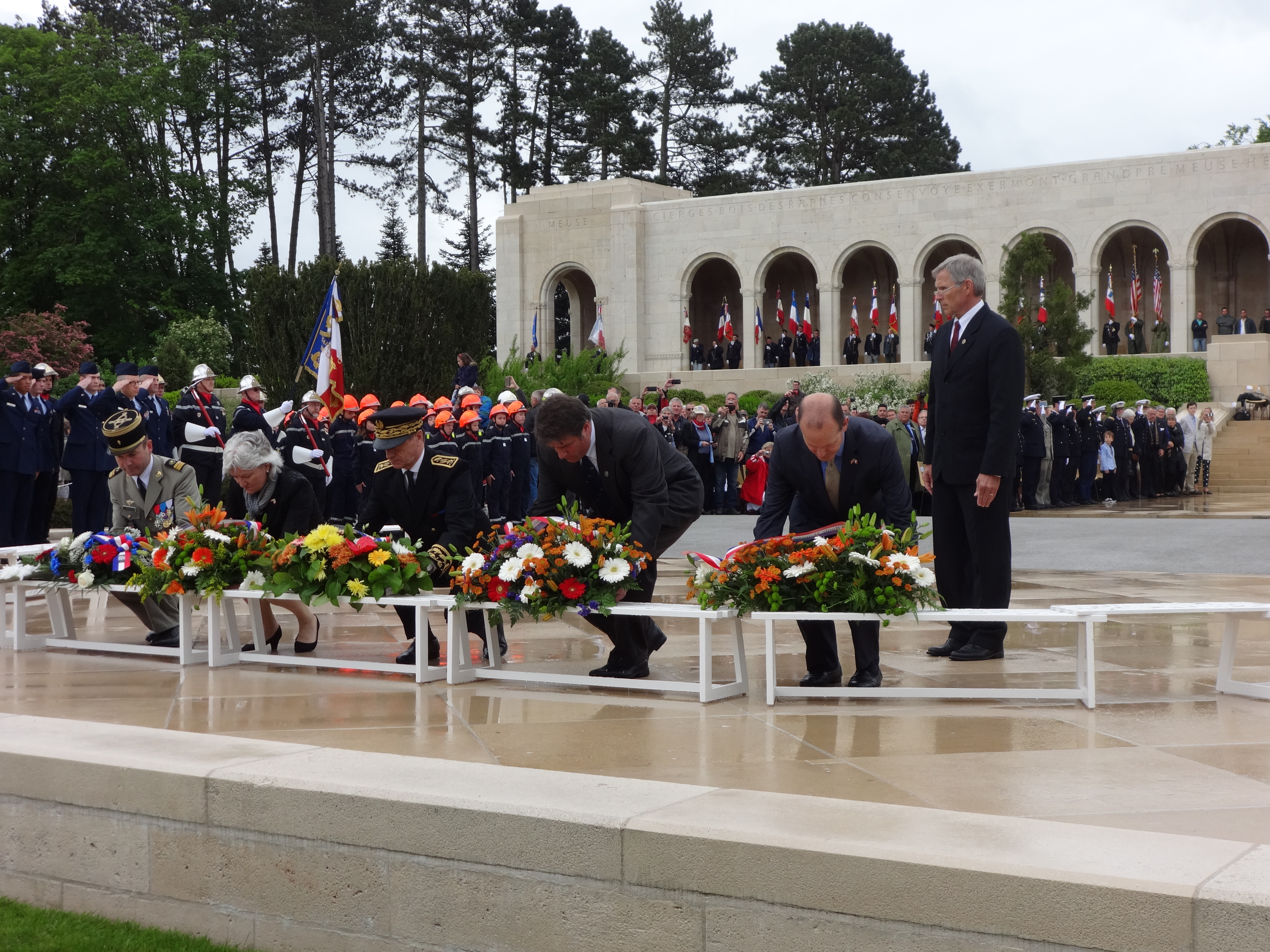 Members of the official party lay floral wreaths during the ceremony. 