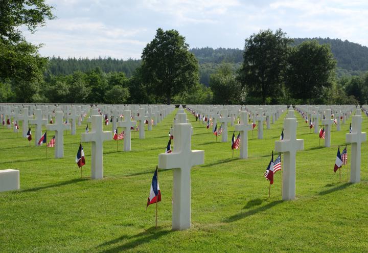 Graves are decorated with flags at Epinal American Cemetery for Memorial Day