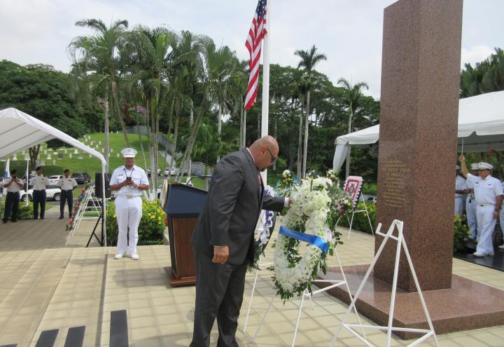 Villalobos pauses to reflect after laying the wreath. 
