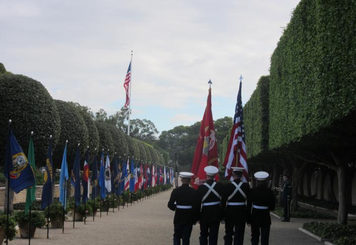 A Marine Color Guard marches out at the end of the ceremony.