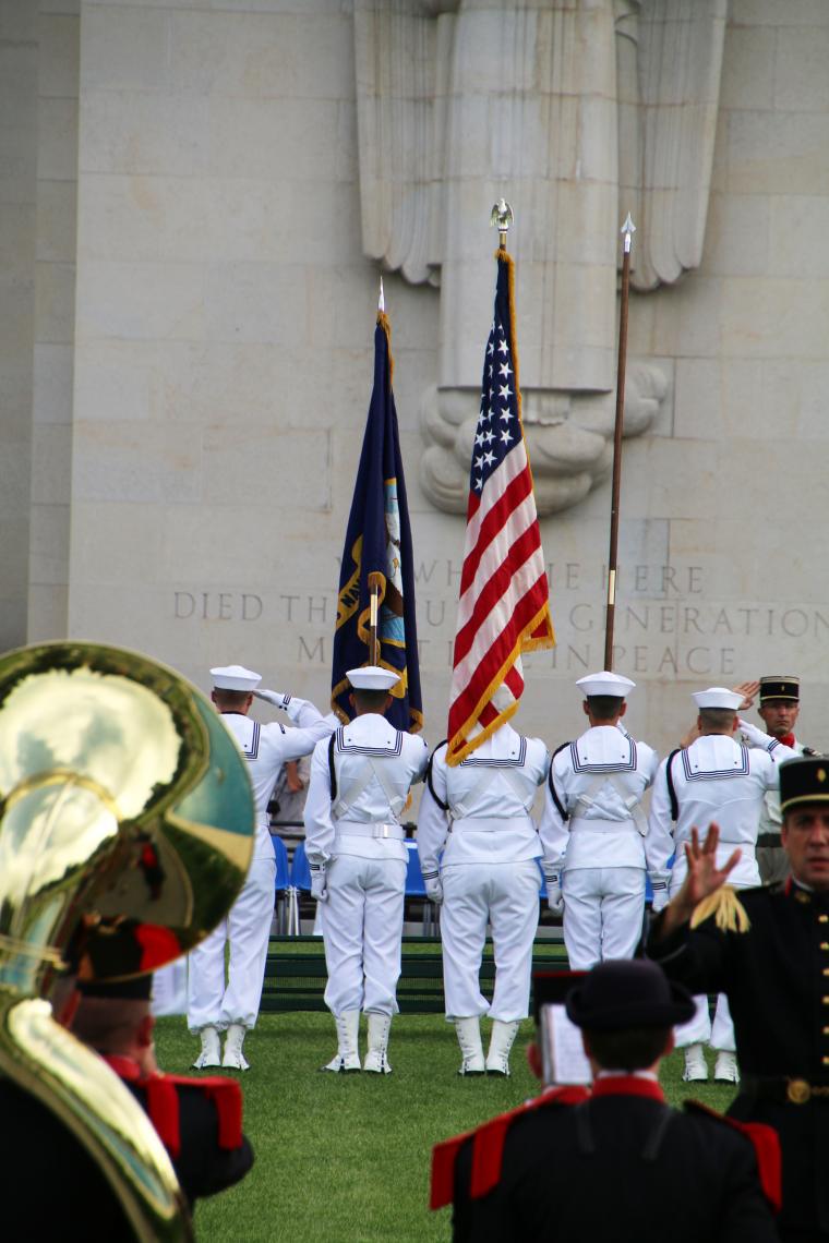 A Navy Honor Guard faces the memorial building during the ceremony. 