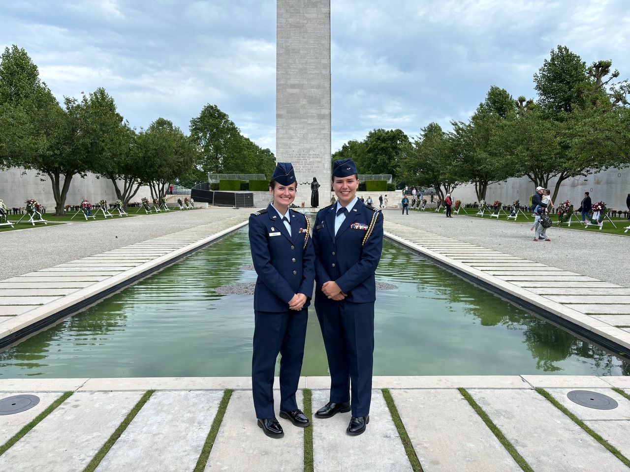 U.S. Air Force ROTC cadets and ABMC International Fellows Anaiya Harris and Catherine Prince stand in front of the memorial tower at the Netherlands American Cemetery. As part of their fellowship, the pair spent about two weeks at the site learning about its operation and assisting with their annual Memorial Day ceremony. Credits: American Battle Monuments Commission.