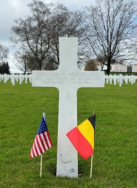 Headstone of Cpl. Bernard T. Woodland at Henri-Chapelle American Cemetery. Credits: American Battle Monuments Commission. 