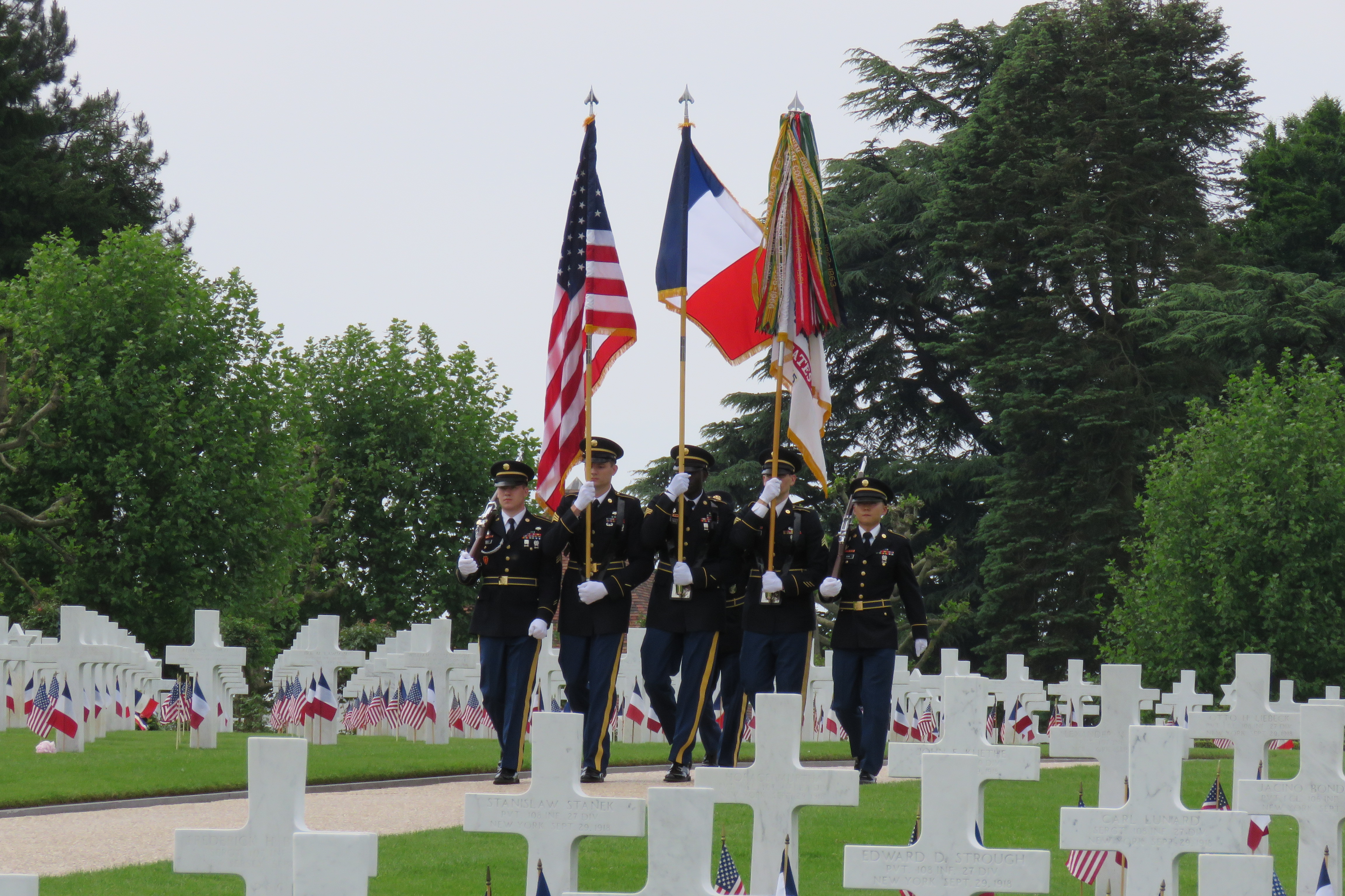 Members of the Honor Guard march through the cemetery.