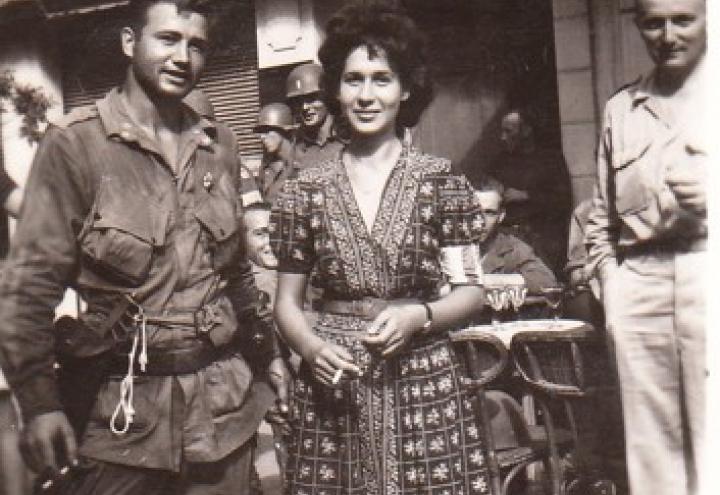 Corporal Burl J. Knapp, 509th Parachute Infantry  Battalion (left) standing next to Nicole  Celebonovitch, a member of the French Resistance. 