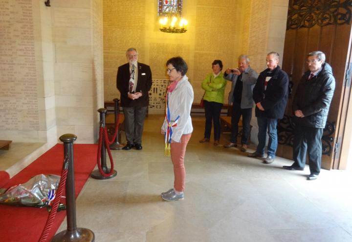 The mayor lays flowers in the chapel at Aisne-Marne American Cemetery. 