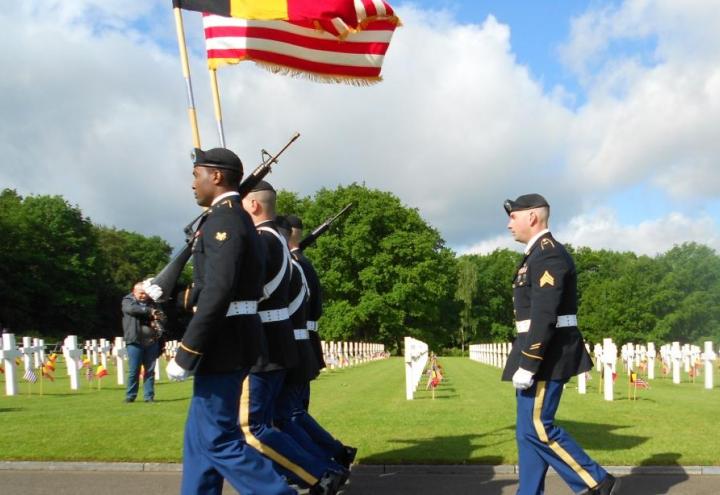 Men in uniform march. 