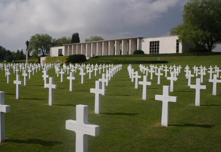 Headstones in front of the memorial building at Henri-Chapelle American Cemetery.