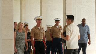 Group of visitors with Vicente Lim IV (Vincci) Manila Visitor Center Director including Commandant of the Marine Corp, walking through the Manila American Cemetery.