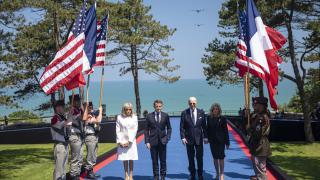 President of the United States Joseph R. Biden Jr. and President of the French Republic Emmanuel Macron, accompanied by their spouses, arrived on stage to honor the nearly 200 WWII veterans