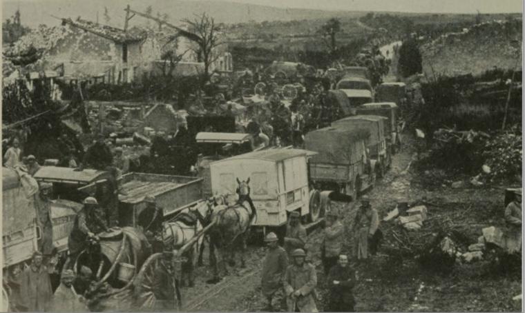 Historic image showing the crowded road of Esnes.