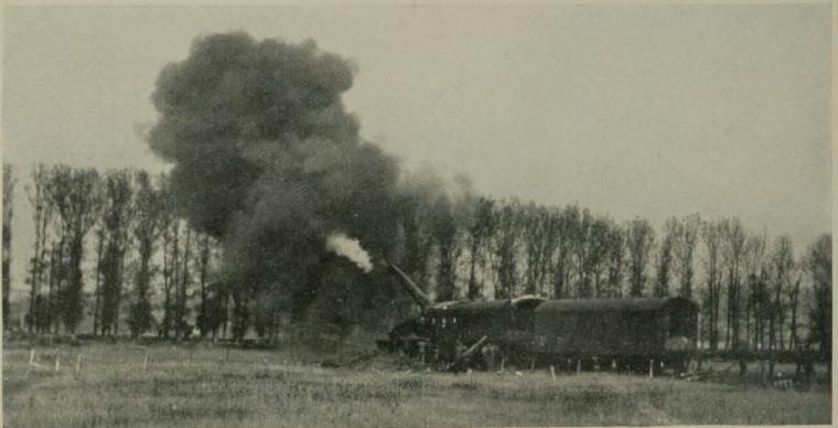 Historic image showing a 14 inch railway mounted gun firing. 