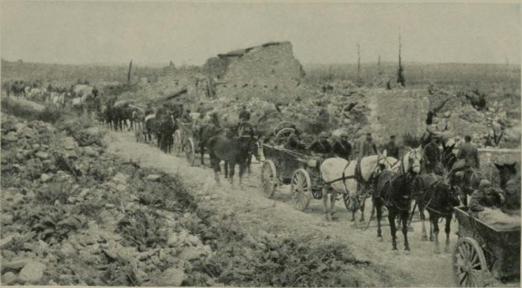 Historic image showing troops with horses and carts.