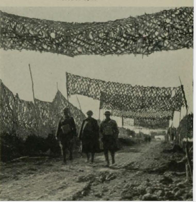 Historic image showing camouflaged elements used to hide th road. 