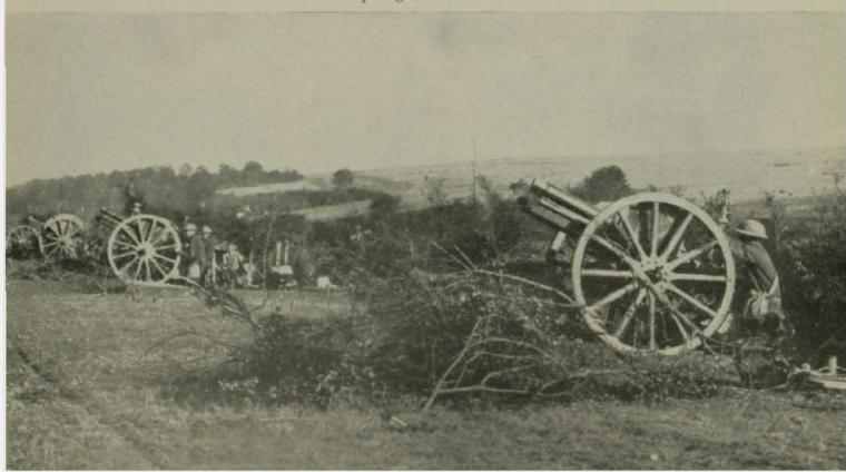 Historic images showing American troops firing large guns. 