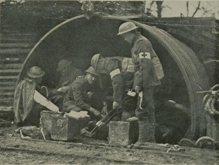 Historic image showing aid station soldiers. 