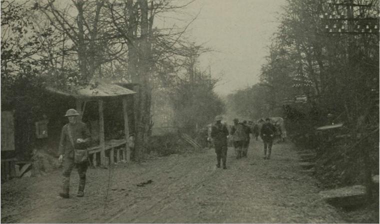 Historic image showing German soldiers walking amongst shelters.