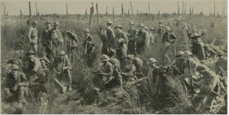 Historic image showing soldiers waiting for instructions. 