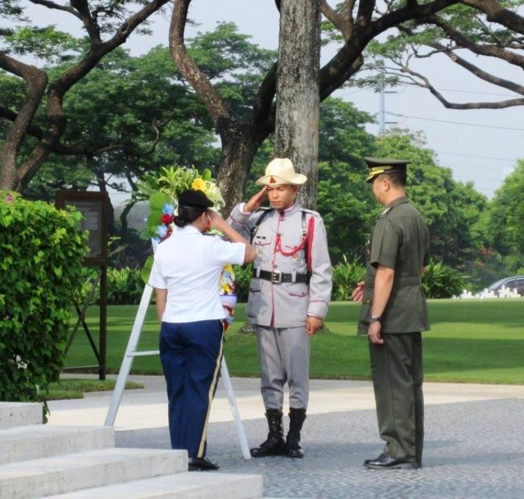 A member of the American and Philippine military salute after the wreath is laid.