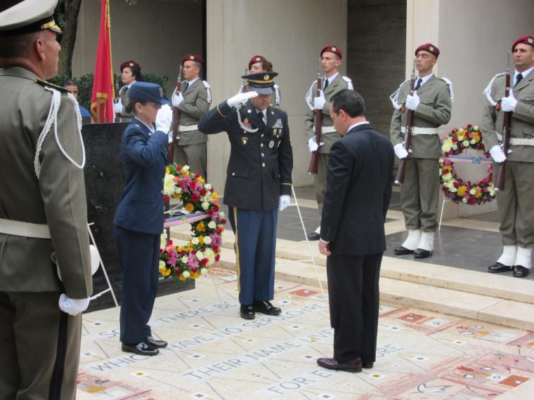 Ambassador Rubinstein pauses and reflects after laying a wreath. 
