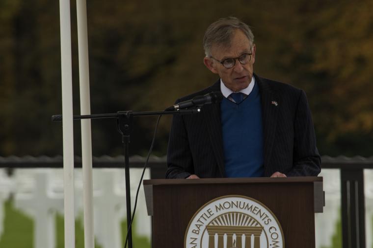Ambassador McKean delivers remarks from a podium.