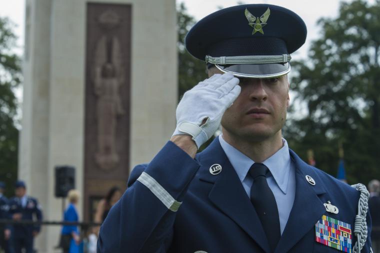 A member of the Air Force salutes during the ceremony. 