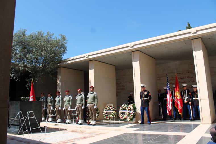 American and Tunisian military in uniform stand during the ceremony. 