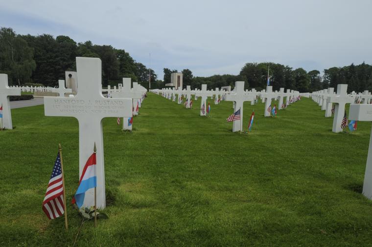 An American and Luxembourgish flag are at the base of every headstone. 