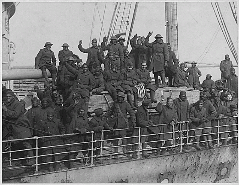 Men of the 369th return to New York on a ship. 