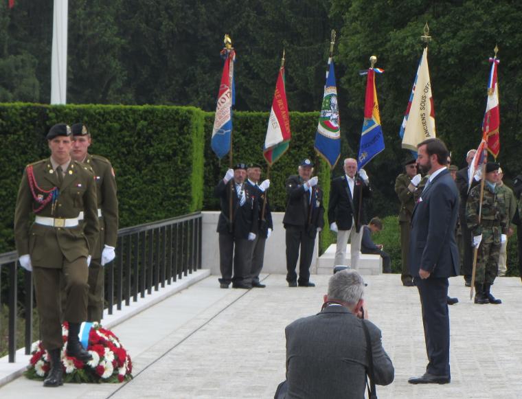 The Crown Prince of Luxembourg lays a wreath during the ceremony. 