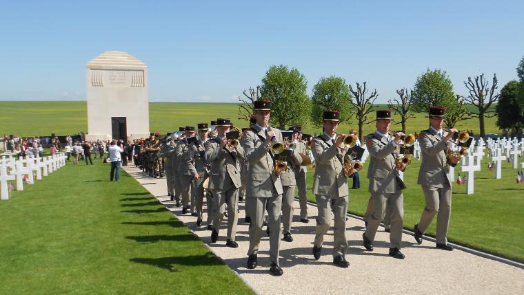 Members of the French military band march and play. 