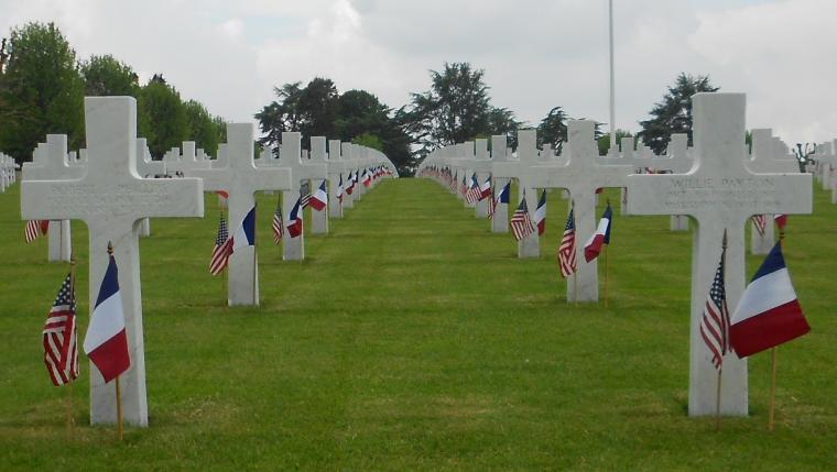 An American and french flag are placed in front of every headstone.