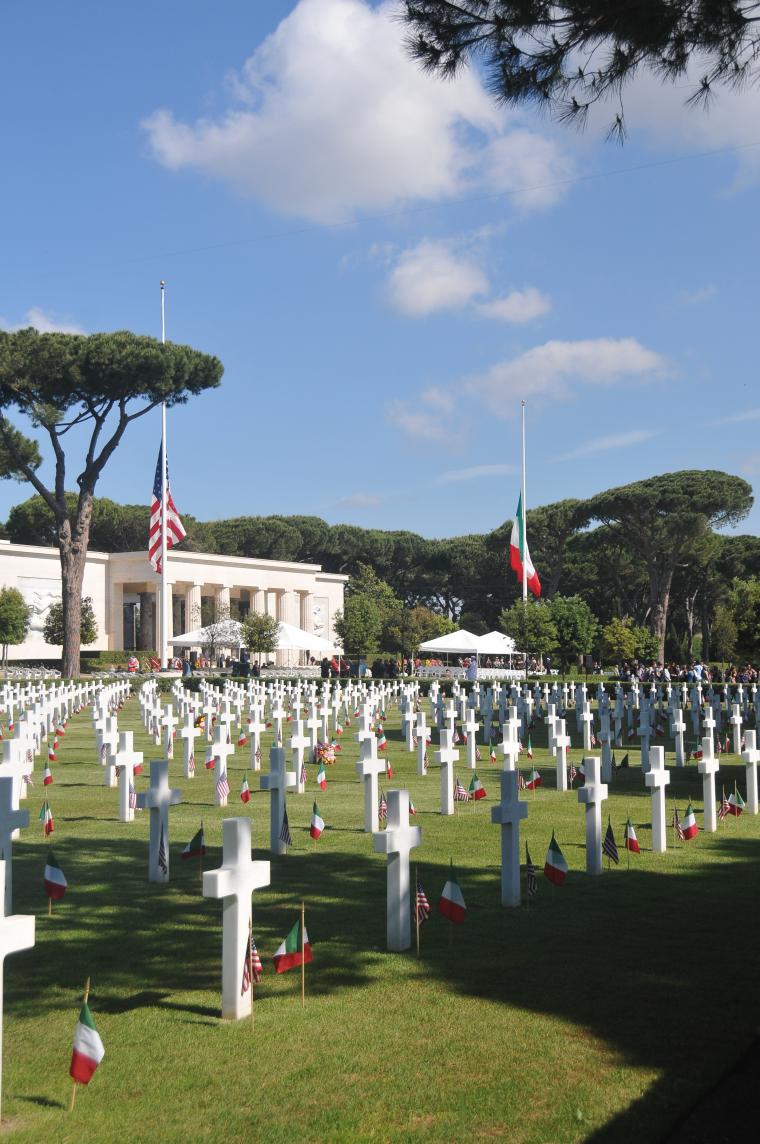 An American and Italian flag are placed in front of every headstone. 