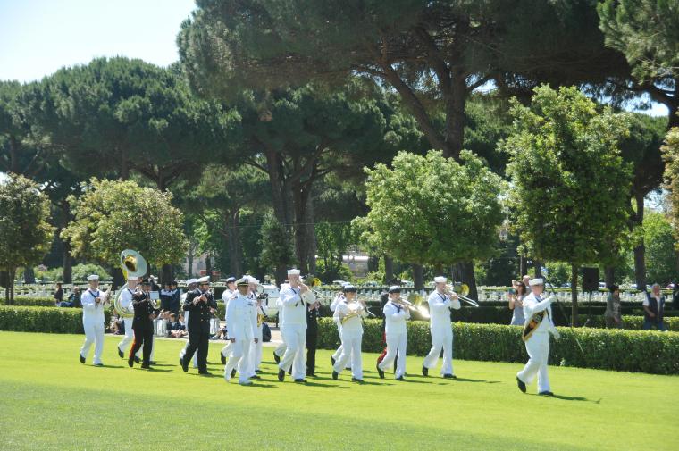Members of a military band march and play during the ceremony. 