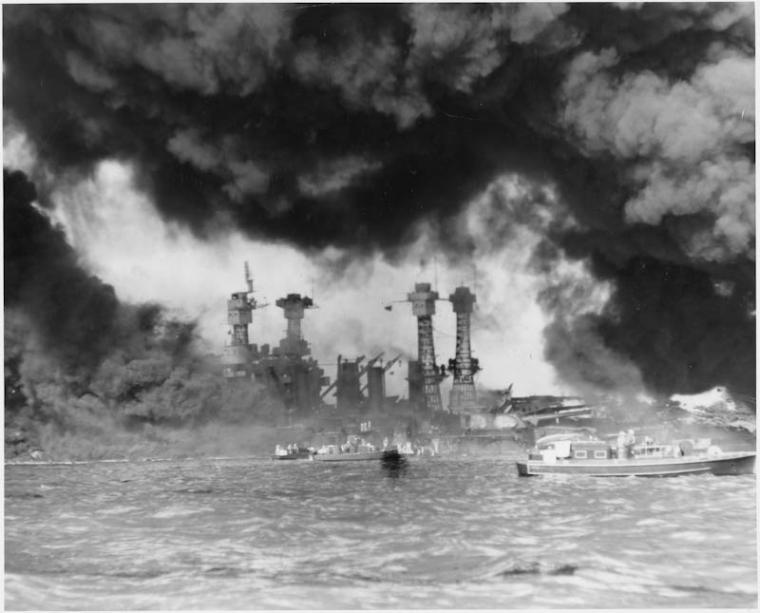 The USS West Virginia and USS Tennessee engulfed in flames after the attack. 