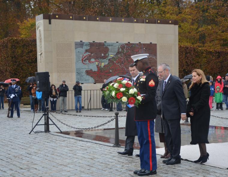 The ambassador and his wife prepare to lay a wreath during the ceremony. 