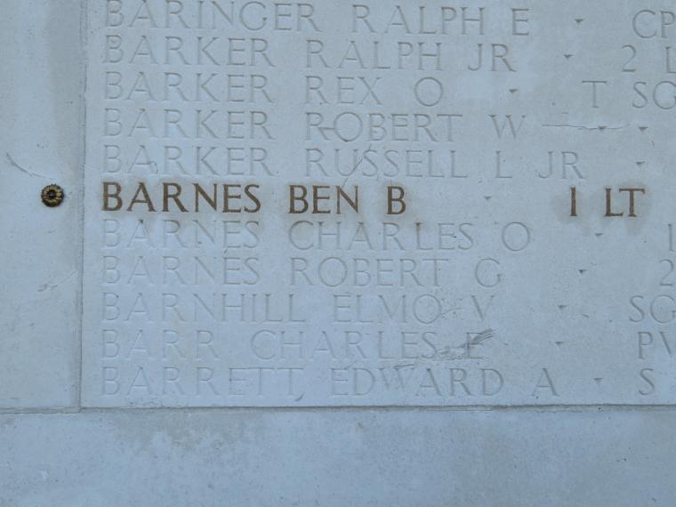 The name and rank of 1st Lt. Ben B. Barnes is highlighted on a stone wall. 