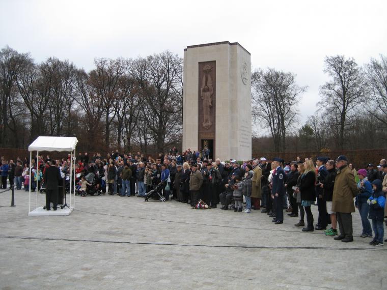 Attendees stand in front of the chapel for the ceremony. 
