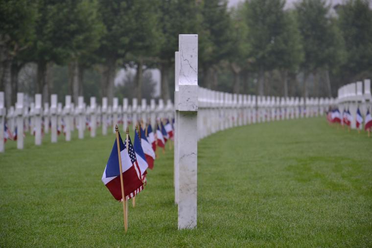 An American and French flag are at the base of every headstone. 