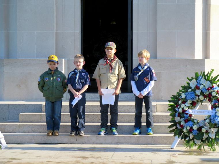 Boy scouts stand in front of chapel during the ceremony. 