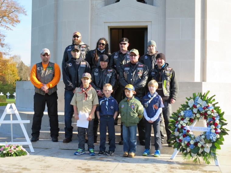 Boy scouts and American Legion Riders stand in front of the chapel.