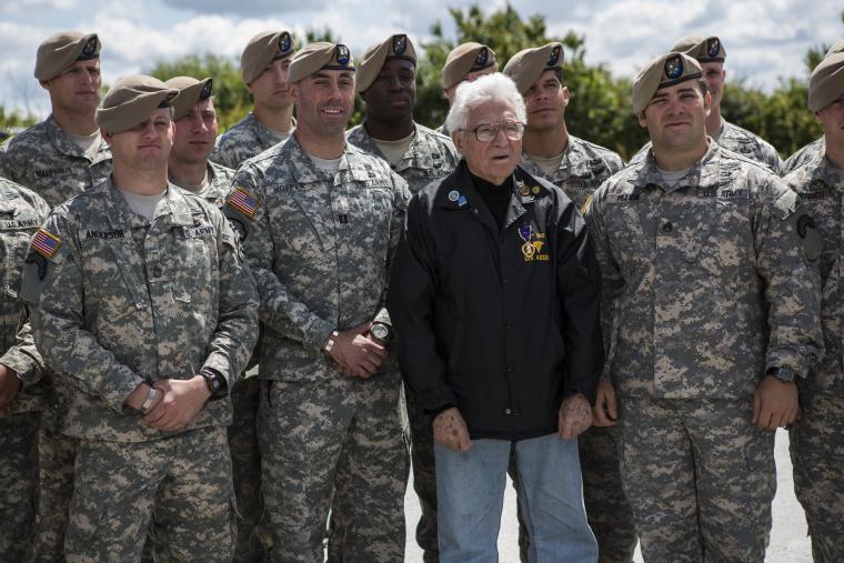 WWII vet Tony Vaccaro stands with members of the Army Rangers. 