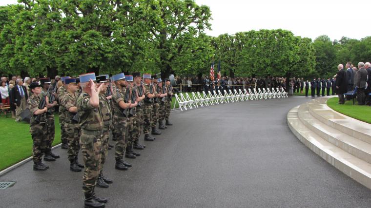 Members of the French military stand during the ceremony. 